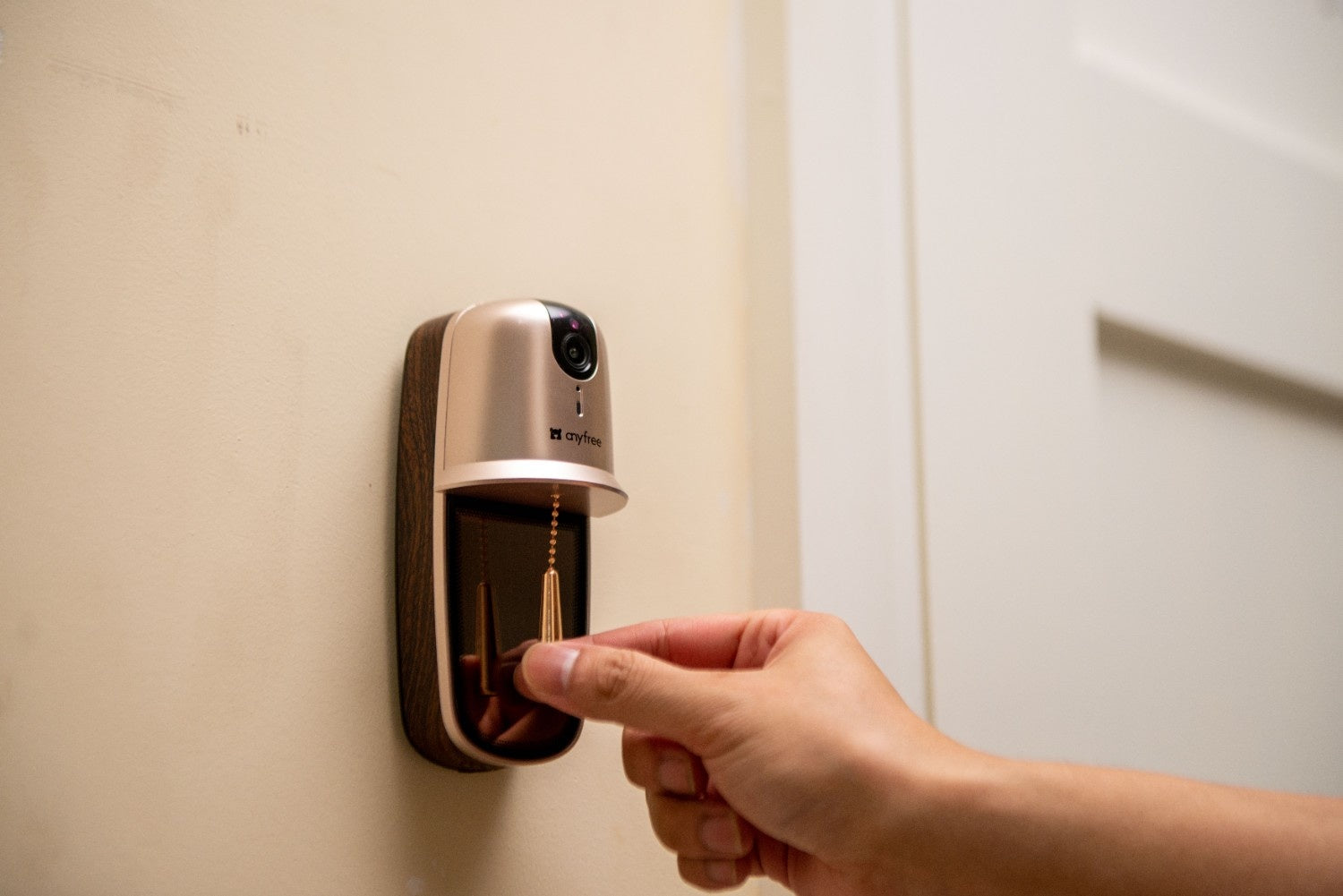 A man pulling the chain of anyfree wireless doorbell